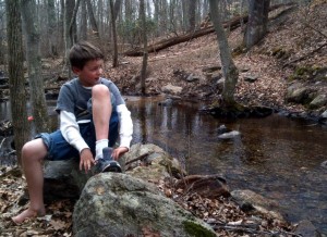 Will putting his shoes on