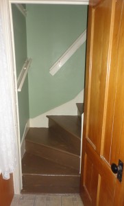 The back stairs after the first coat of paint. The goal was to pick a brown that would go with the green hallway. I'm not sure the picture does the colors justice.
