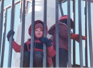 Playing on the rocket ship at the park Webster Groves with Bill