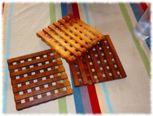 Completed 7-inch square trivets (two from walnut and one from possible maple)