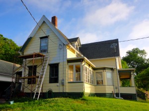 The house almost painted.