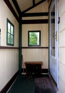 The porch color scheme (Sherwin-William's Concord Buff, Rookwood Dark Green, and Rookwood Brown). The painting scheme was planned by Susanna.