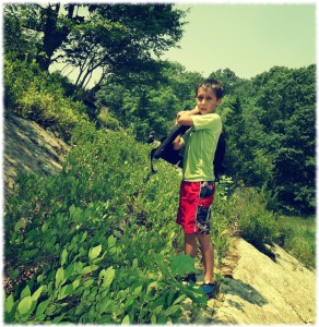 Ben exploring the rock outcrop