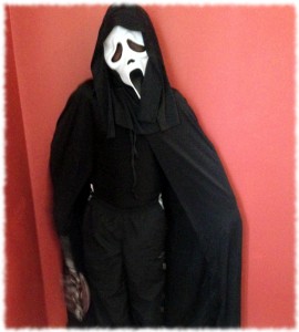 Will showing off his Halloween costume. Nice and scary.