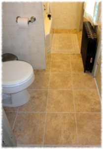 Bathroom with the new tiles and repainted radiator.