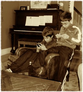 Will and Ben enjoy a quiet moment on their iPods this morning.