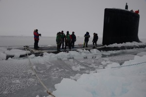 140322-N-RB579-323 ICE CAMP NAUTILUS (March 22, 2014) Sailors aboard the Virginia-class attack submarine USS New Mexico (SSN 779) tie mooring lines after the submarine surfaces through the arctic ice during Ice Exercise (ICEX) 2014. ICEX 2014 is a U.S. Navy exercise highlighting submarine capabilities in an arctic environment. (U.S. Navy photo by Mass Communication Specialist 2nd Class Joshua Davies/Released)