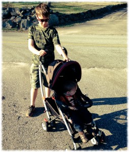 Will pushing Michael on our walk down the street. He needed a snack and a break from his brother.