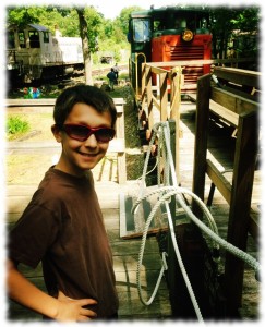 Ben waiting for a ride on a flat car.