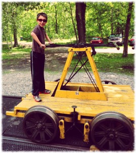 Ben on the handcar. We were able to take the car up and down the track.
