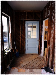 Mud room with part of the floor removed.