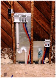 The washer and sink connections plumbed in.