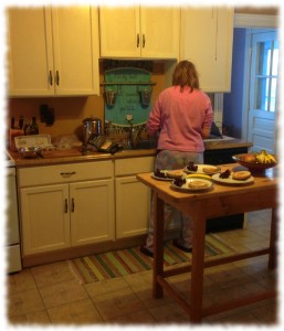 Susanna cooking breakfast on our snowy morning.