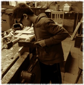 Ben sawing the legs of his shaker shop stool