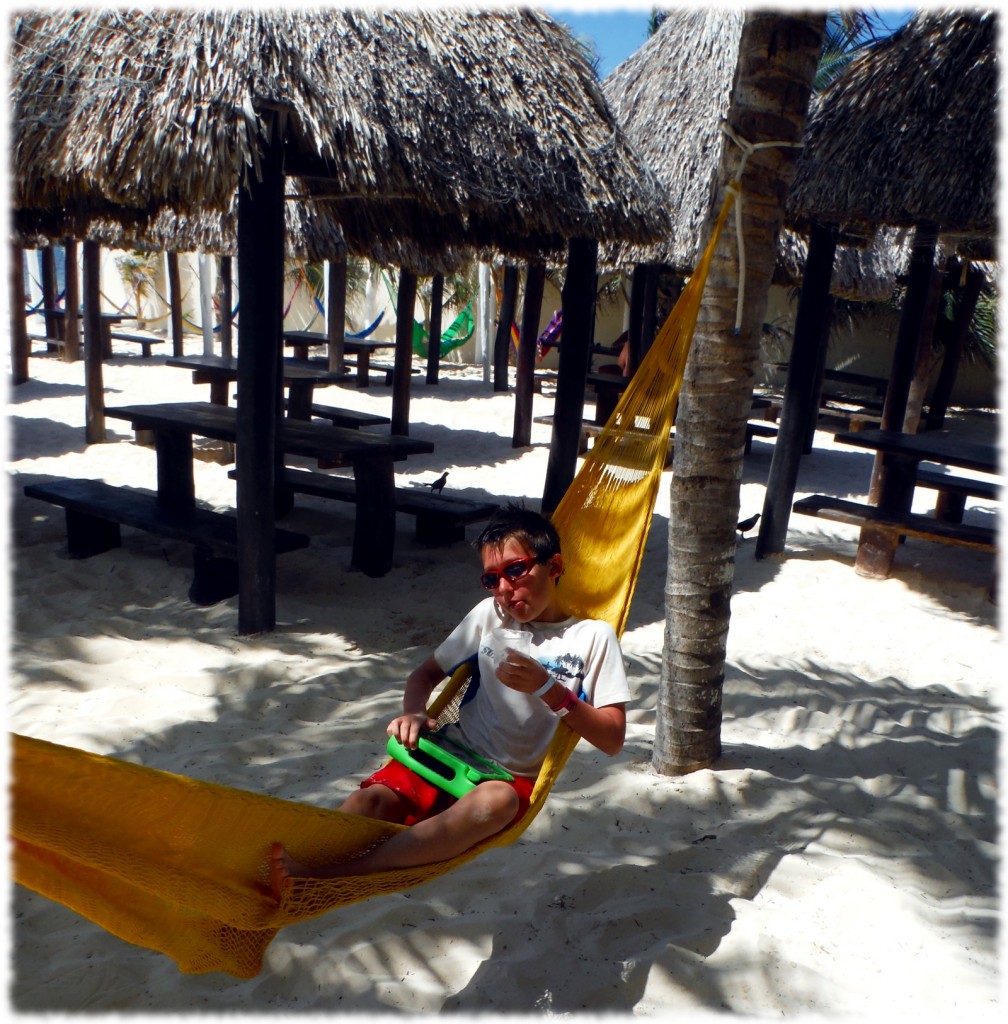 Benjamin enjoying a break after snorkeling, before our van ride back to the hotel. "Dad, can you get me another drink, please?"