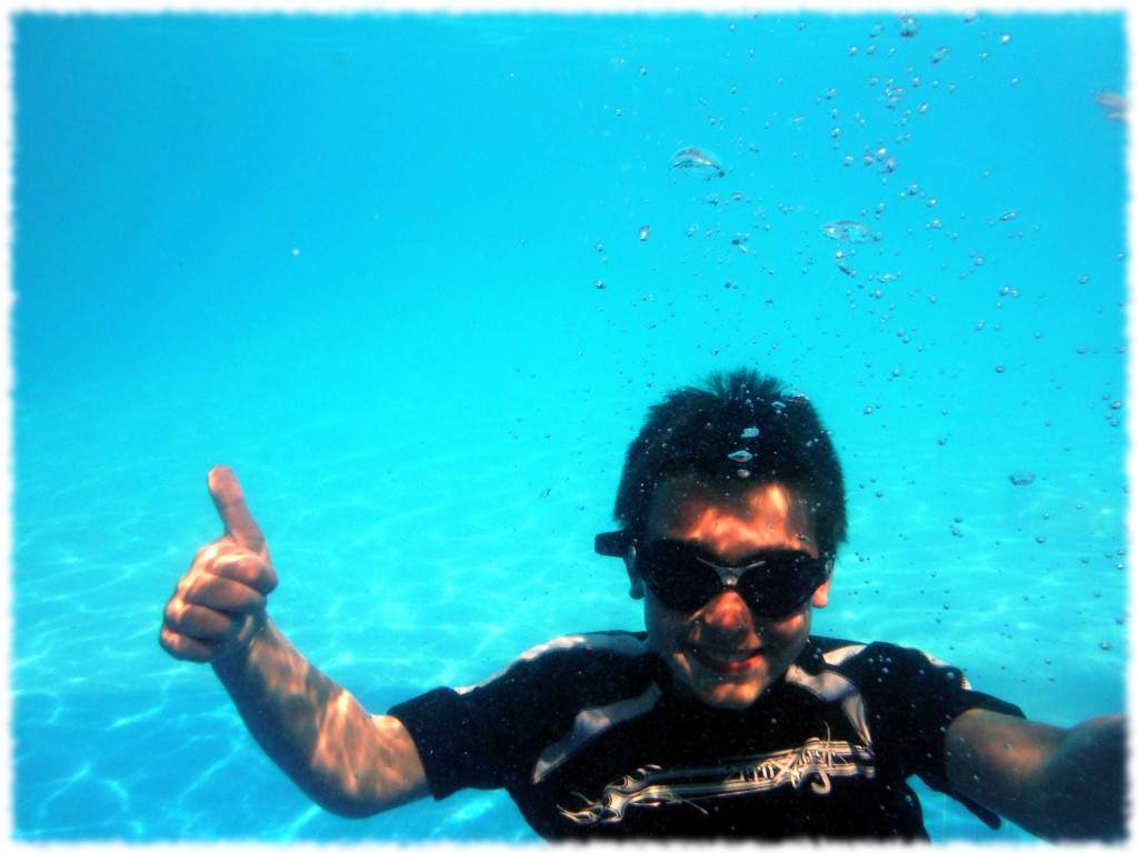 Benjamin enjoying the swimming pool at the resort.