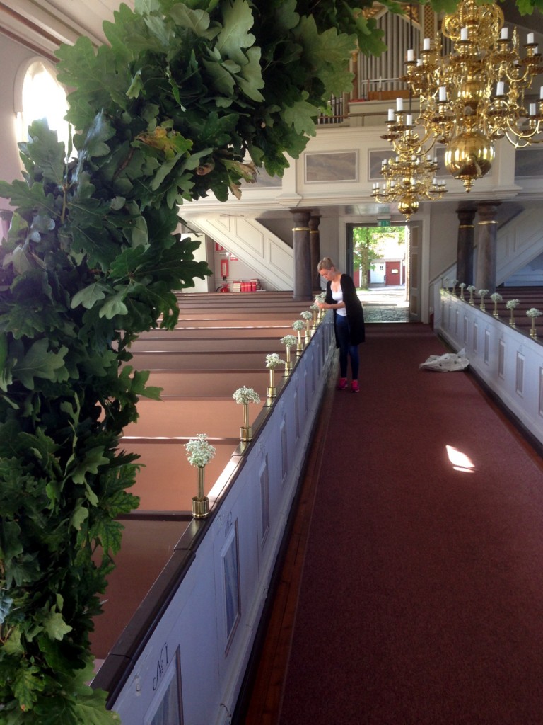 Susanna's sister, Sofia, setting up flowers at the church the day before her wedding.