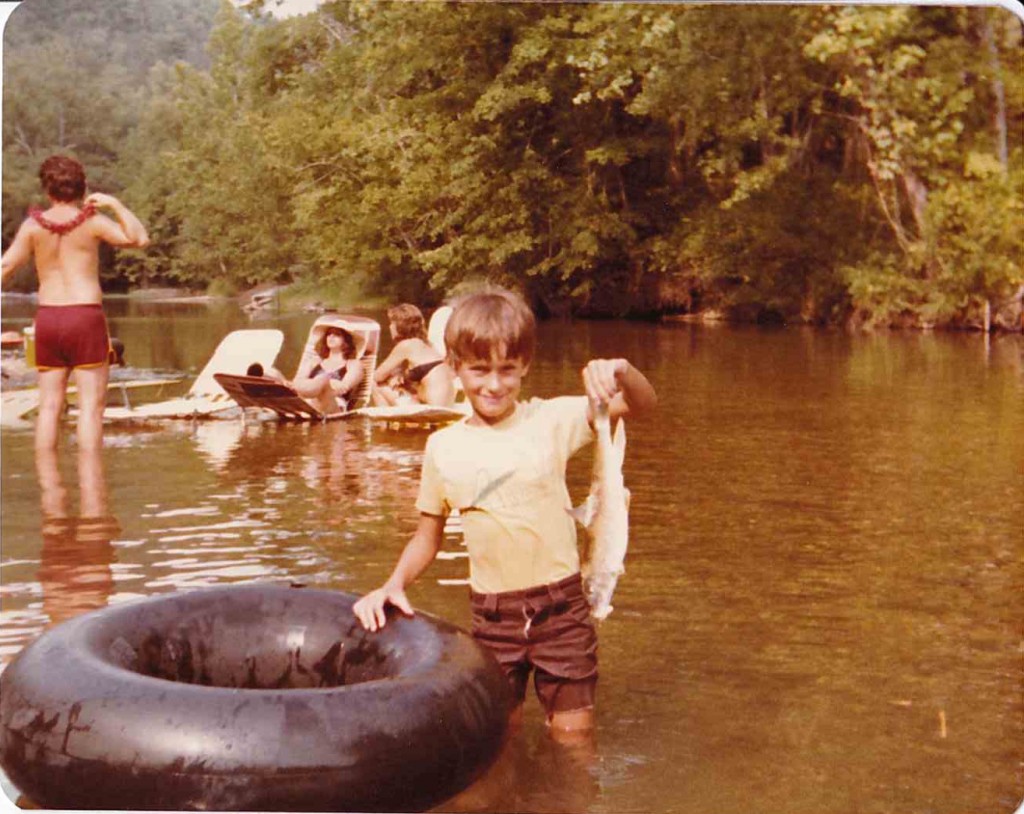 Chuck Curtis and his "catch." Current River canoe trip, 1980