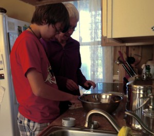 Will and his grandmother working on making apple crisp