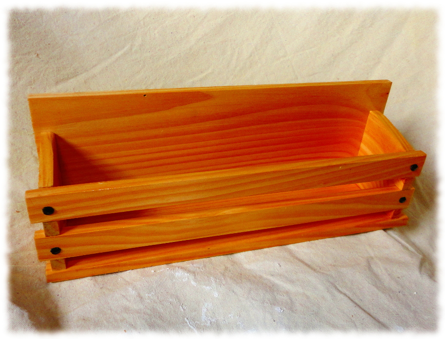 Book display made from pine and finished with clear shellac.
