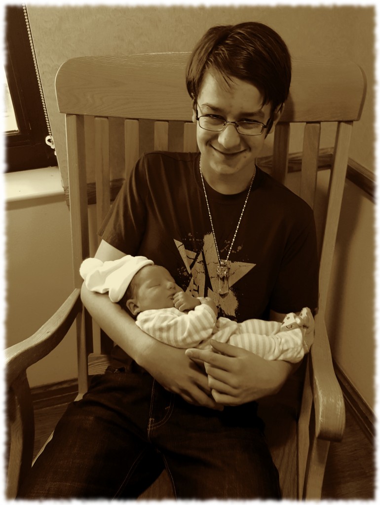 Will holding his little sister this morning before we took her home.