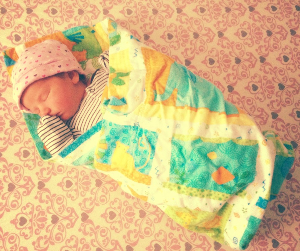 Sleeping in her crib at home this afternoon.