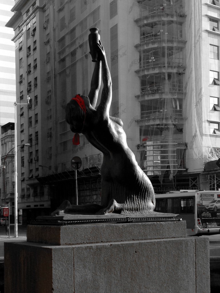 Statue in Rio de Janeiro with her eyes covered by a red blindfold as a part of a protest against the government.