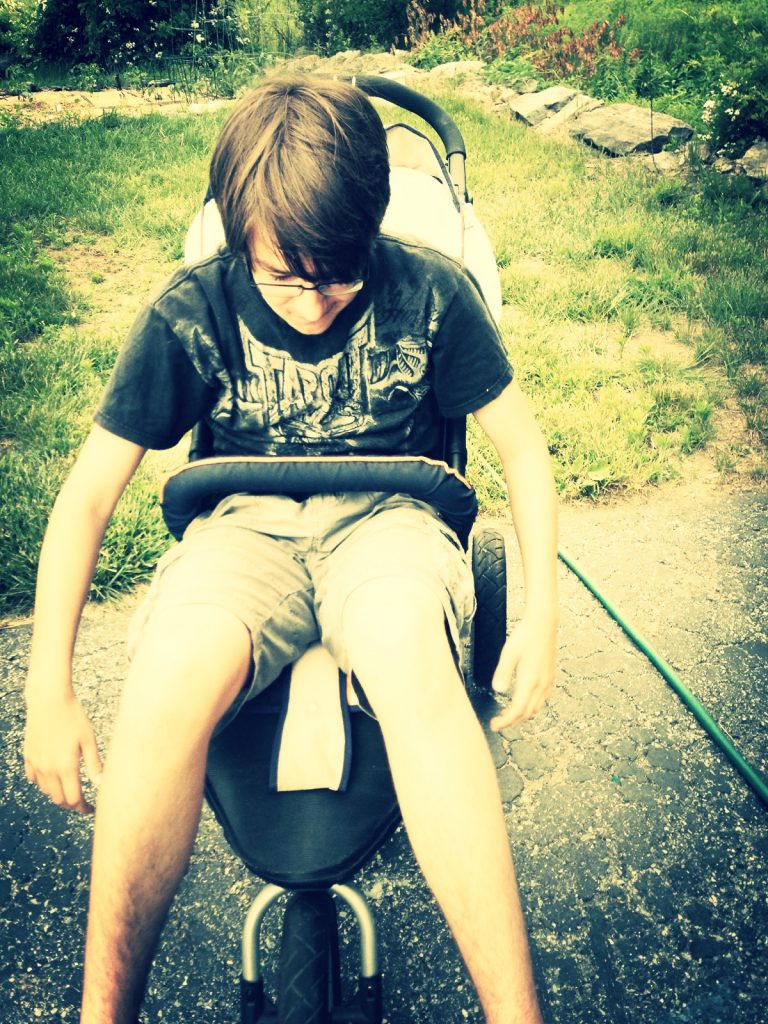 Hanging out in the jogging stroller. 