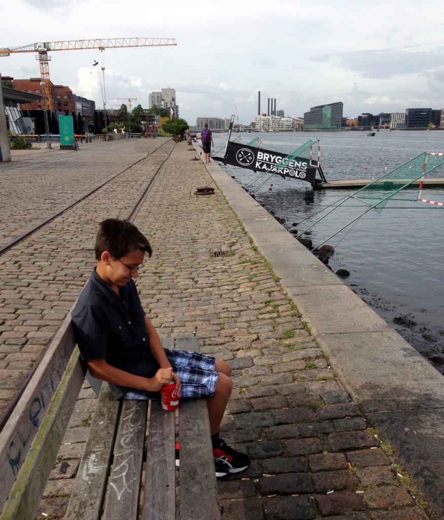 Ben taking a Coke break along the canal in front of our apartment