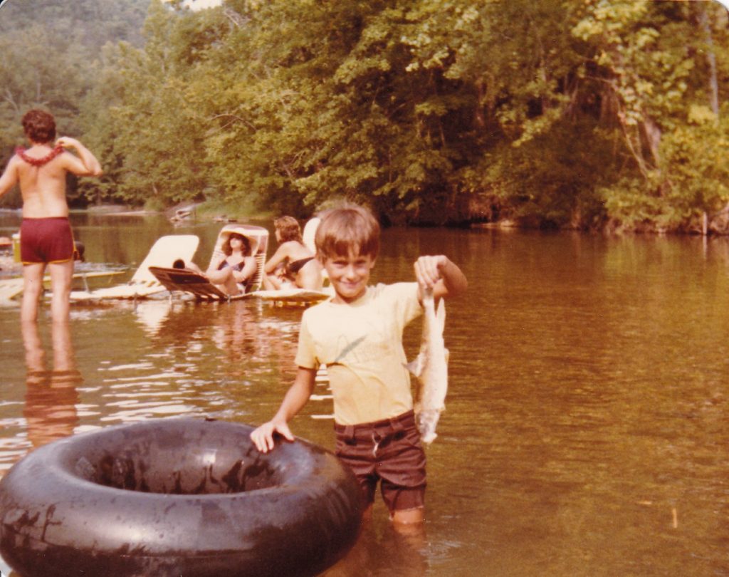 Chuck Curtis and his "catch" - Current River canoe trip (1980)